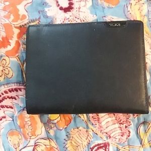Black leather tumi passport holder